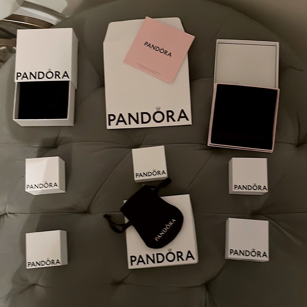 A PANDORA gift box set 9 pieces in all along with a bag, envelope and pamphlet